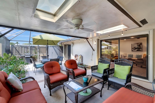 view of patio / terrace featuring a grill, a lanai, outdoor lounge area, and ceiling fan