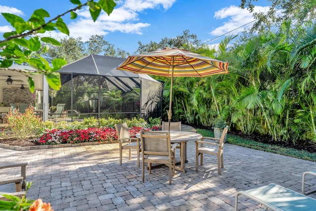 view of patio / terrace featuring a lanai