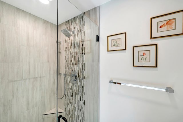 bathroom with a tile shower