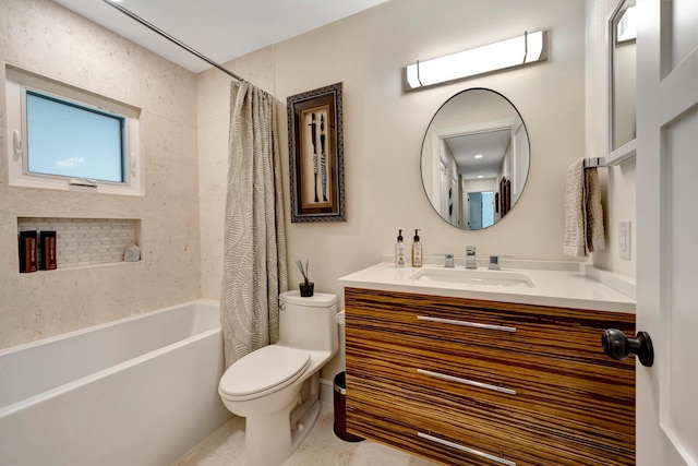 full bath featuring vanity, shower / bath combo with shower curtain, and toilet