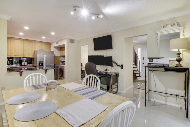 tiled dining space with crown molding