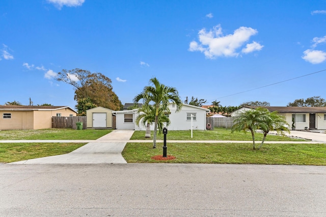 single story home with a front yard