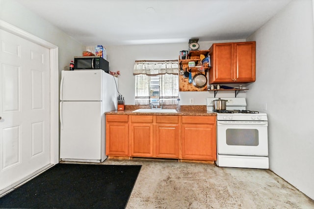 kitchen featuring sink and white appliances