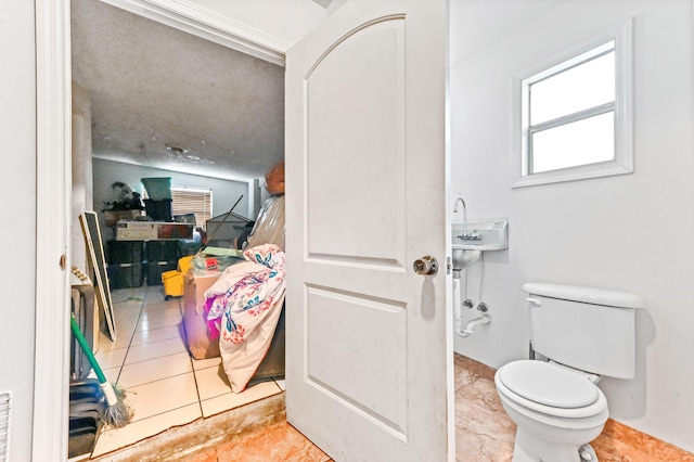 bathroom with tile patterned floors and toilet