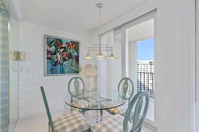 dining space featuring crown molding and a textured ceiling