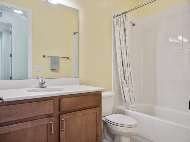 full bath with visible vents, toilet, shower / bath combo, and vanity