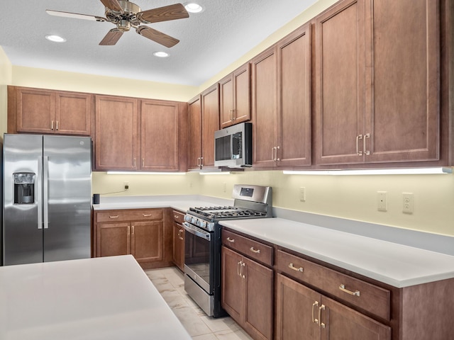 kitchen with brown cabinets, recessed lighting, stainless steel appliances, light countertops, and ceiling fan