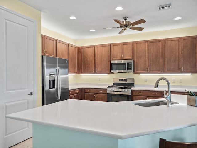 kitchen with visible vents, recessed lighting, a sink, light countertops, and appliances with stainless steel finishes