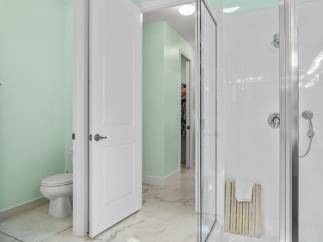 full bathroom with baseboards, toilet, marble finish floor, and a stall shower