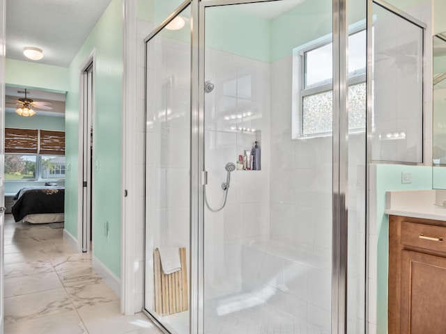 ensuite bathroom with vanity, a shower stall, marble finish floor, and ensuite bathroom
