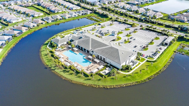 birds eye view of property with a residential view and a water view