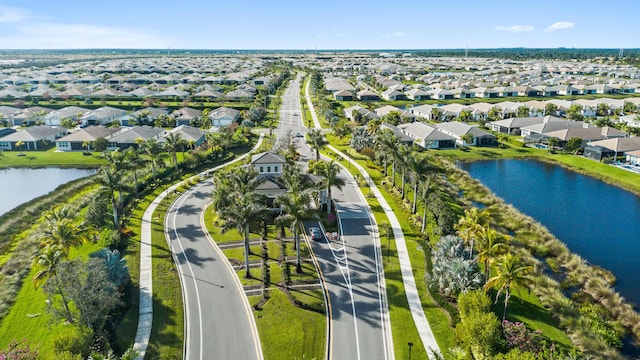 bird's eye view featuring a residential view and a water view