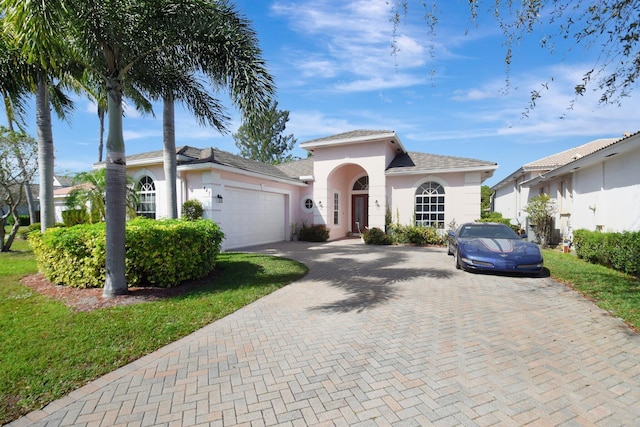 mediterranean / spanish-style home featuring a garage