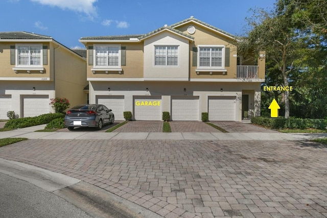 view of front of property with a garage