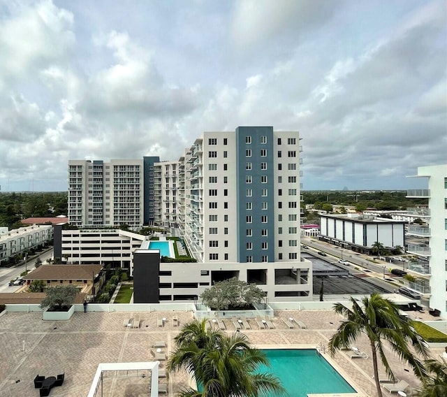 view of building exterior with a community pool