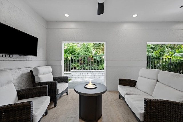 living room featuring ceiling fan, wood finished floors, and recessed lighting