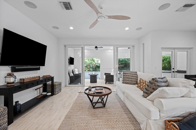 wooden deck featuring fence, an outdoor hangout area, a ceiling fan, and a patio