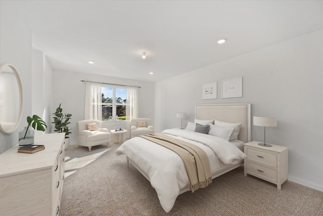 bedroom with recessed lighting and light colored carpet