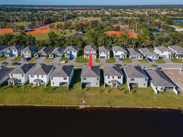 aerial view with a residential view and a water view