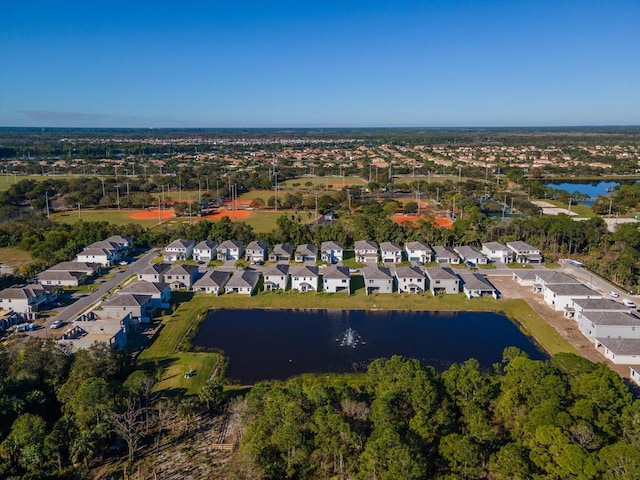 drone / aerial view with a residential view and a water view