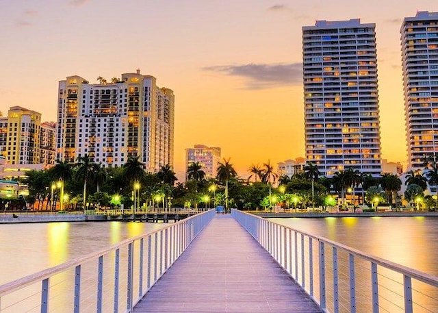 exterior space featuring a view of city and a water view