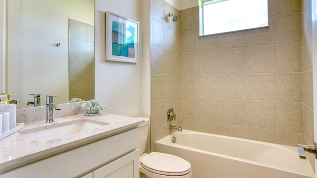 full bath with toilet, vanity, and shower / tub combination