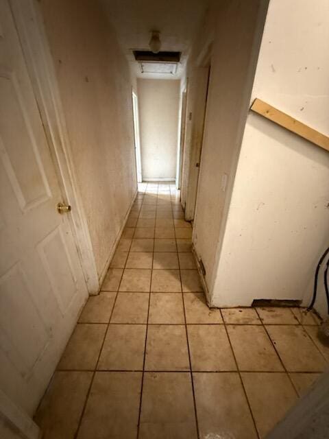 hallway with light tile patterned floors