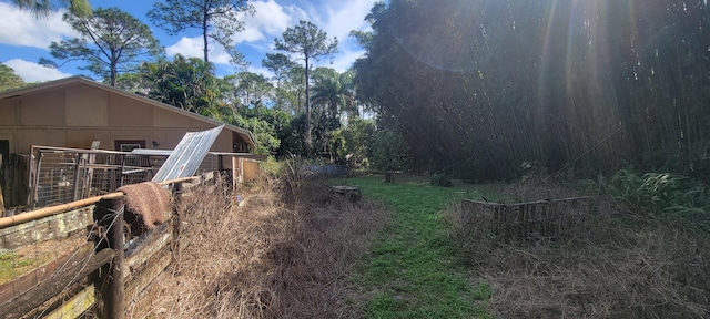 view of yard featuring an exterior structure and an outdoor structure