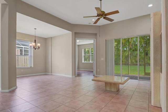 6731 Southport Dr W, Boynton Beach, FL 33472 - empty room with light tile patterned flooring, baseboards, recessed lighting, and ceiling fan with notable chandelier