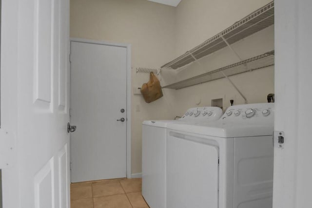 6731 Southport Dr W, Boynton Beach, FL 33472 - washroom with washing machine and clothes dryer, light tile patterned flooring, and laundry area