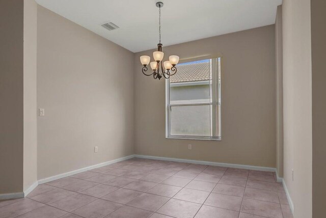 6731 Southport Dr W, Boynton Beach, FL 33472 - spare room featuring baseboards, visible vents, an inviting chandelier, and light tile patterned floors