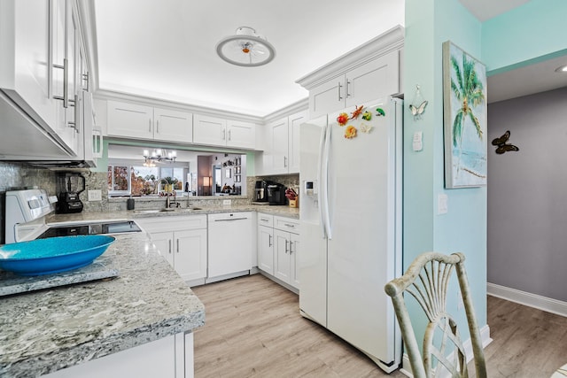 kitchen featuring white cabinetry, white appliances, sink, and backsplash