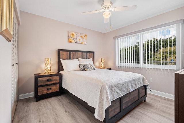 bedroom featuring light hardwood / wood-style floors and ceiling fan