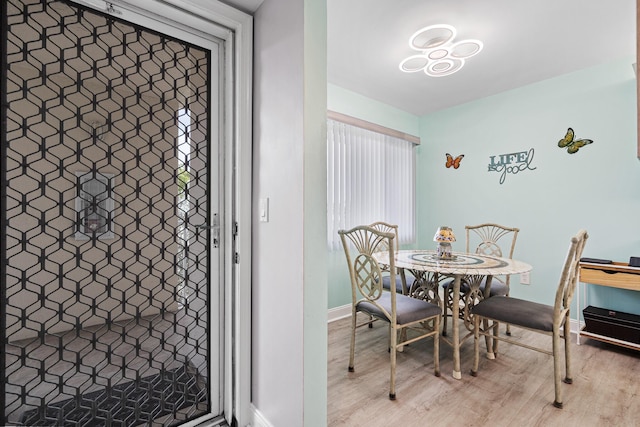 dining space featuring hardwood / wood-style flooring