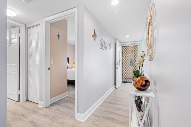 hall with light hardwood / wood-style flooring