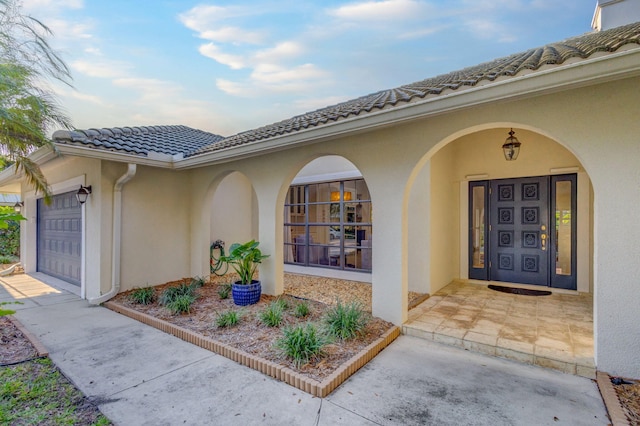 doorway to property featuring a garage