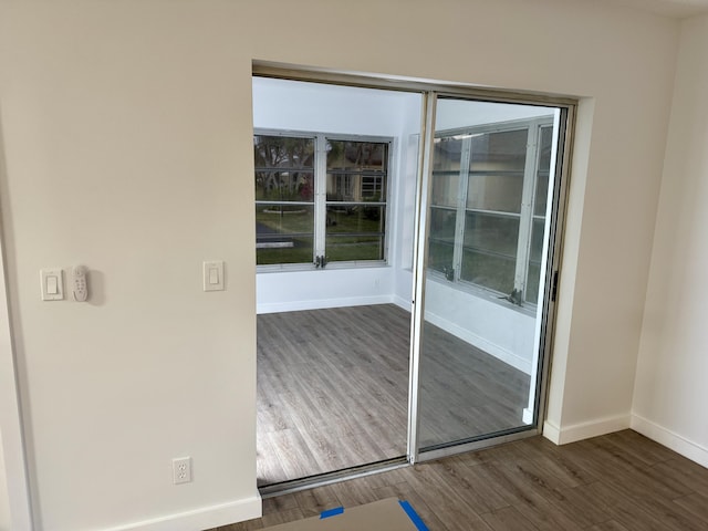 spare room featuring dark hardwood / wood-style flooring