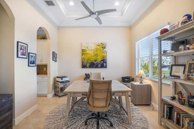 office area featuring crown molding, ceiling fan, and a tray ceiling