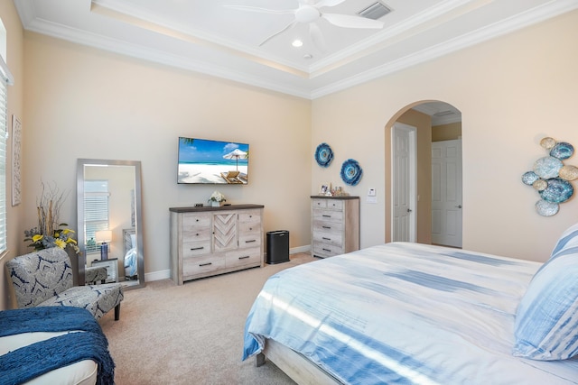 carpeted bedroom featuring crown molding and ceiling fan