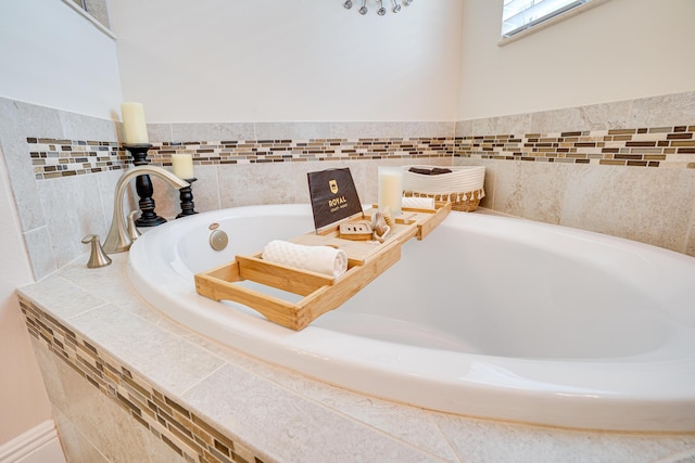 bathroom featuring a relaxing tiled tub