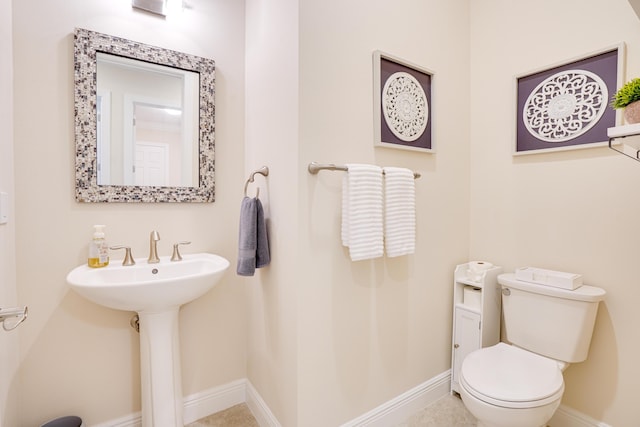 bathroom with sink and toilet