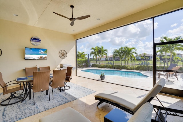 view of swimming pool featuring a patio and ceiling fan