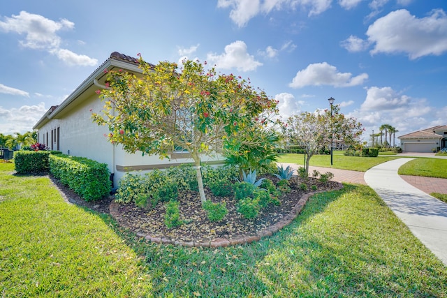 view of home's exterior with a lawn