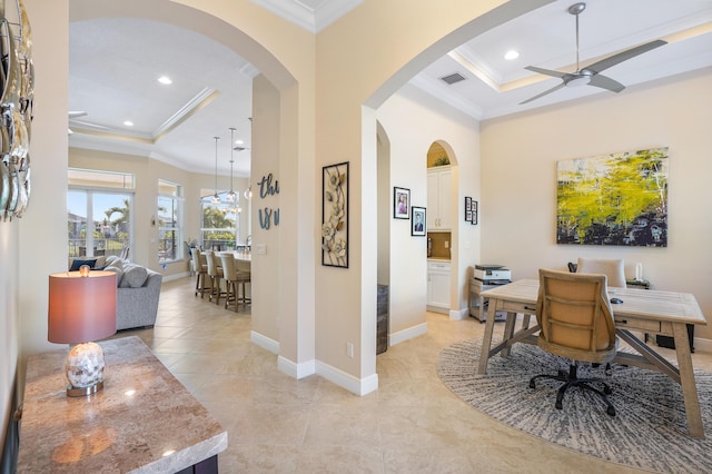 office with a raised ceiling, ornamental molding, light tile patterned flooring, and ceiling fan