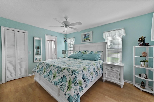 bedroom with ceiling fan and light wood-type flooring