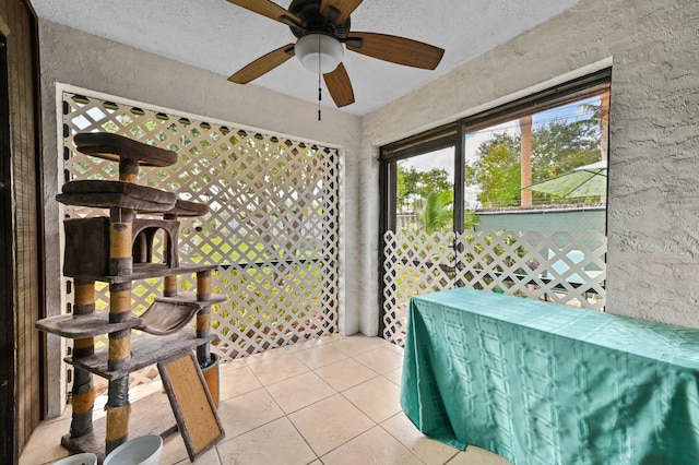 sunroom / solarium with ceiling fan