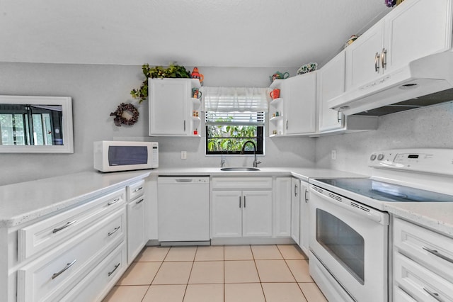 kitchen with white cabinetry, white appliances, sink, and light tile patterned floors