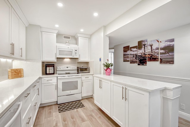 kitchen featuring white cabinetry, white appliances, light hardwood / wood-style floors, and decorative backsplash