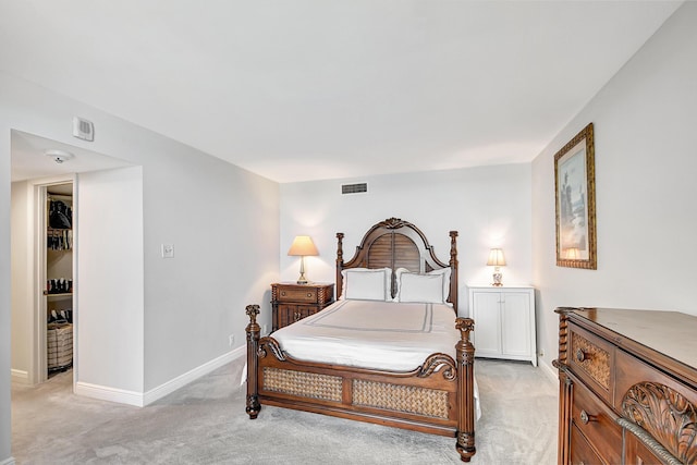 bedroom with light colored carpet