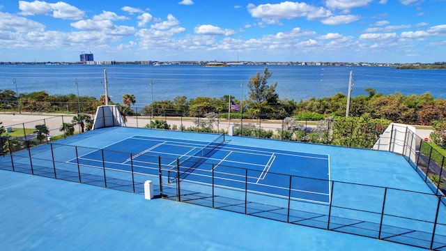 view of sport court featuring a water view